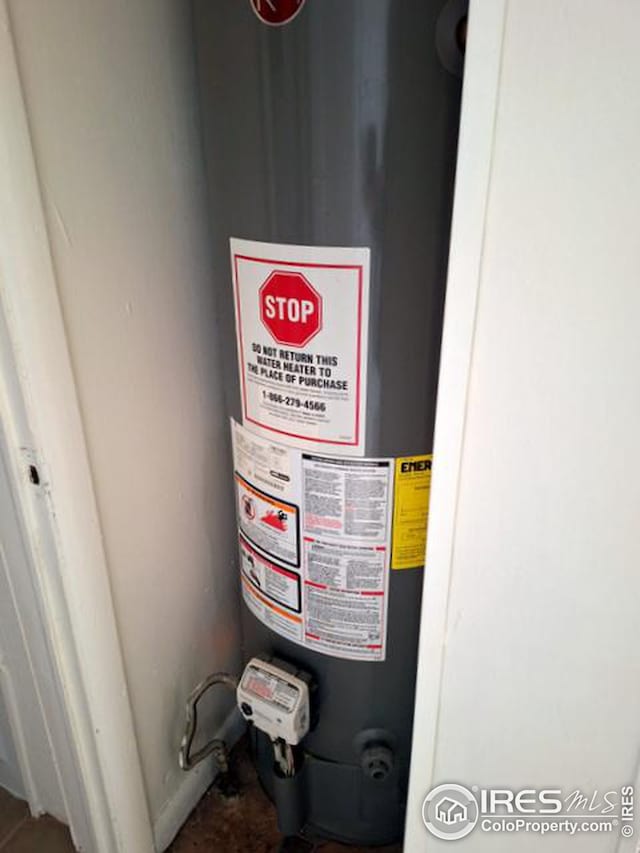 utility room featuring water heater