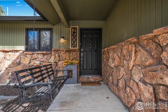 view of exterior entry with stone siding