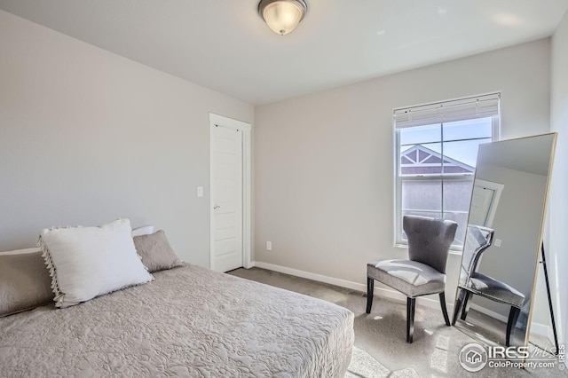 carpeted bedroom with baseboards