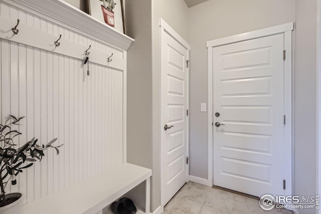 mudroom with marble finish floor