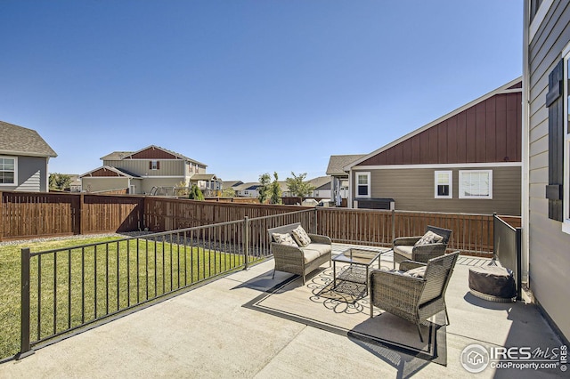 view of patio / terrace featuring a residential view, a fenced backyard, and an outdoor hangout area
