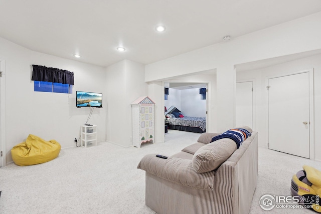 sitting room featuring carpet and recessed lighting