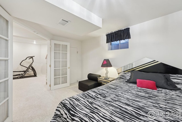 bedroom featuring carpet, visible vents, and french doors