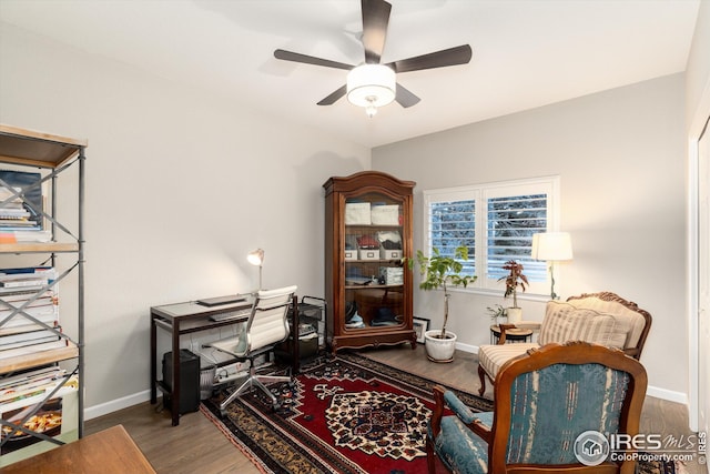 office with ceiling fan, baseboards, and wood finished floors