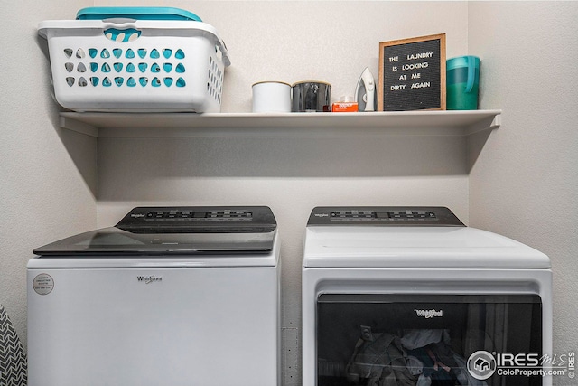 washroom featuring laundry area and independent washer and dryer