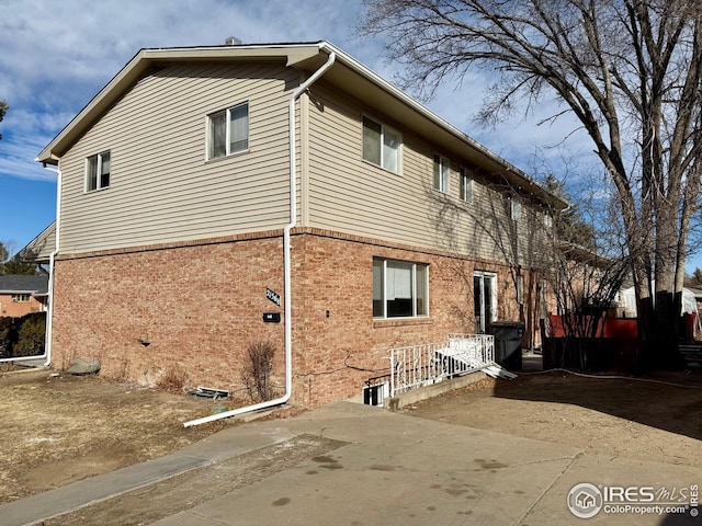 view of home's exterior featuring brick siding