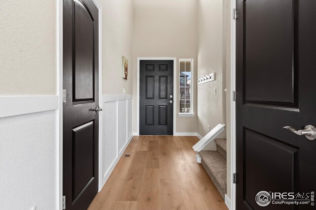 foyer entrance with light wood-style flooring