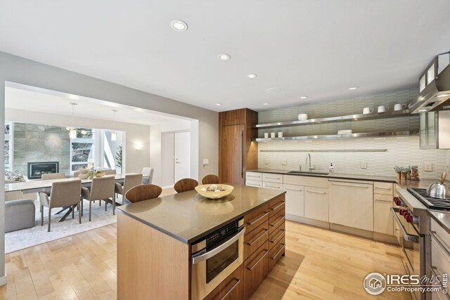 503 Kalmia Ave, Boulder, CO 80304 - kitchen with open shelves, appliances with stainless steel finishes, dark countertops, and a sink