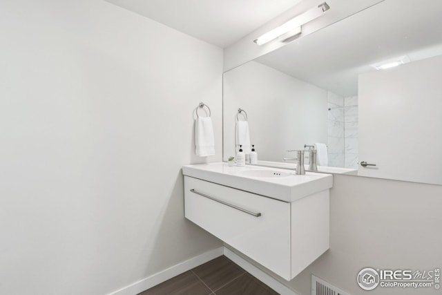 503 Kalmia Ave, Boulder, CO 80304 - bathroom with visible vents, vanity, and baseboards