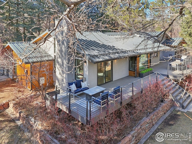 503 Kalmia Ave, Boulder, CO 80304 - rear view of house featuring a deck, metal roof, and stucco siding
