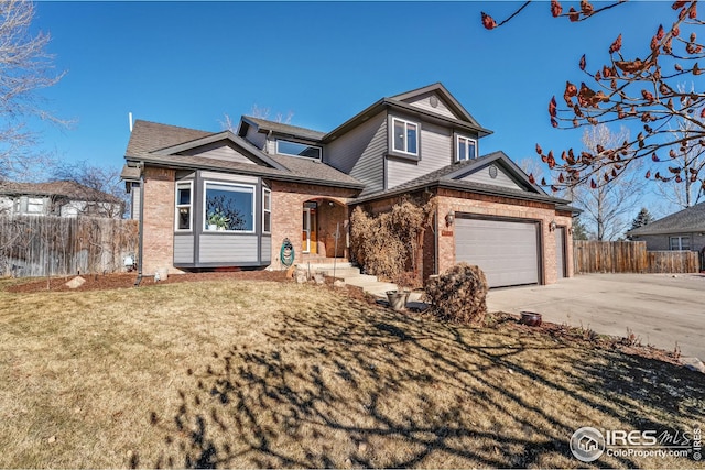 view of front of property with brick siding, fence, a garage, driveway, and a front lawn