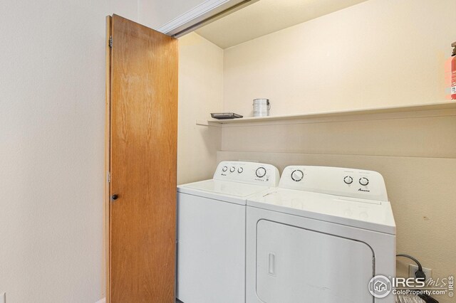 clothes washing area featuring laundry area and independent washer and dryer