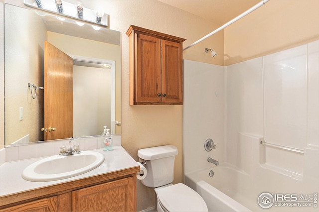 full bath featuring shower / tub combination, vanity, and toilet