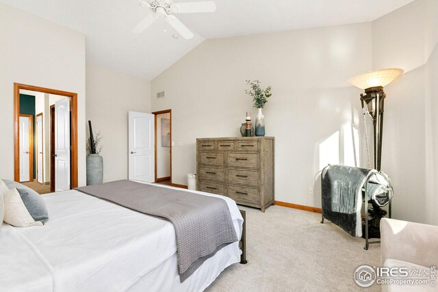 bedroom featuring visible vents, light colored carpet, baseboards, high vaulted ceiling, and a ceiling fan