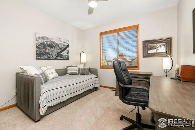 bedroom with a ceiling fan, carpet flooring, and baseboards