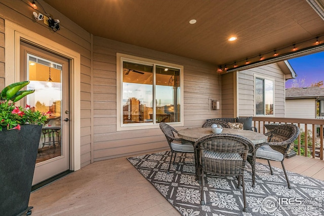 deck with outdoor dining area