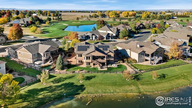 aerial view featuring a residential view and a water view