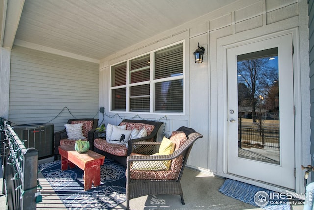 view of patio / terrace with a porch and central AC