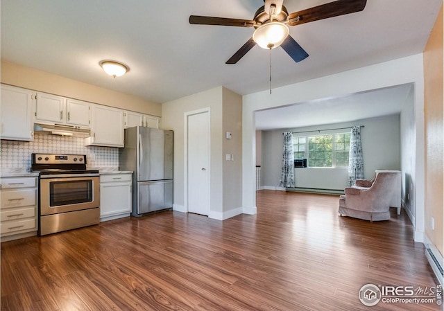 kitchen with dark wood-style floors, stainless steel appliances, backsplash, white cabinets, and under cabinet range hood