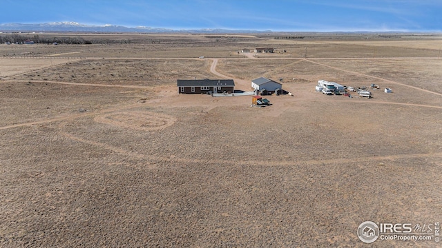 bird's eye view featuring a mountain view, a rural view, and view of desert