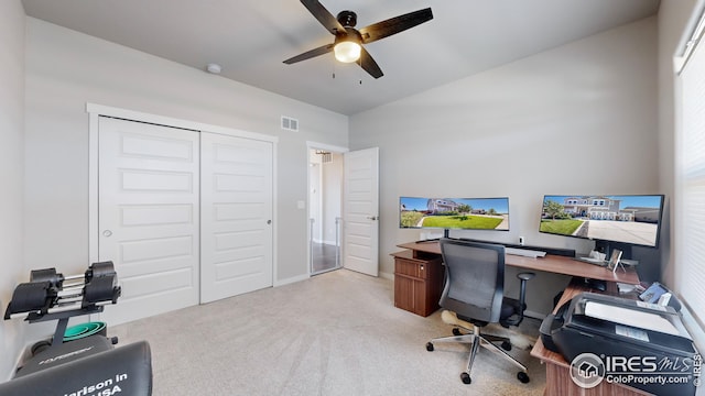 carpeted office featuring ceiling fan, visible vents, and baseboards