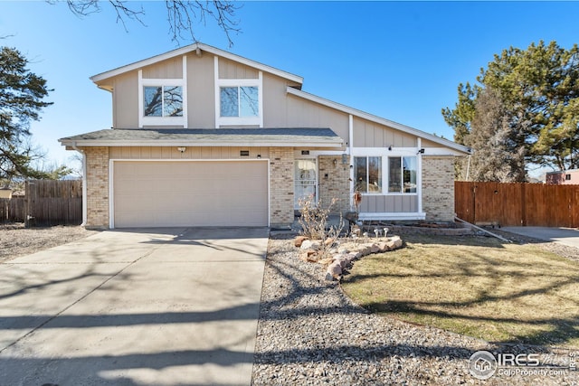 view of front of house with a garage, fence, concrete driveway, and brick siding