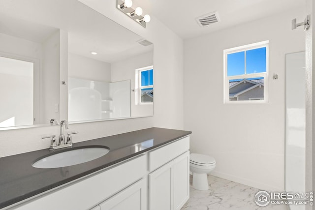 full bath featuring marble finish floor, visible vents, toilet, vanity, and baseboards