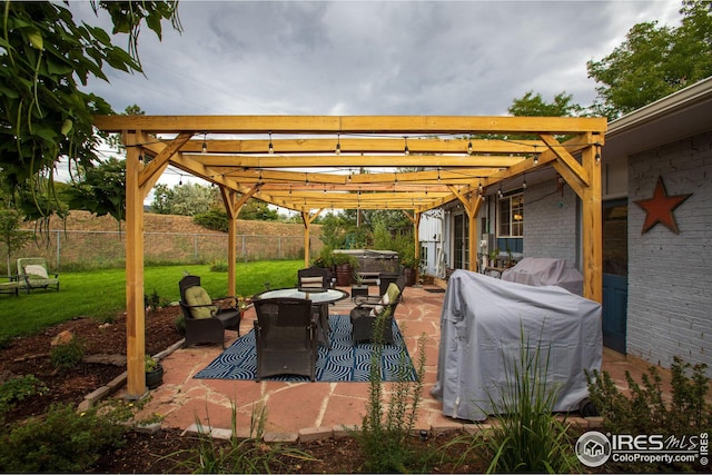 view of patio / terrace with a grill, fence, and a pergola