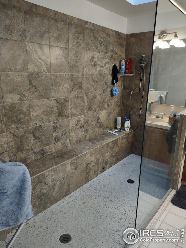 full bath with tile patterned flooring and walk in shower