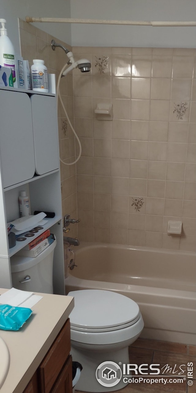 full bath with toilet, shower / bathtub combination, and vanity