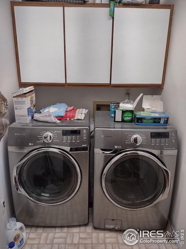 laundry area featuring cabinet space and independent washer and dryer