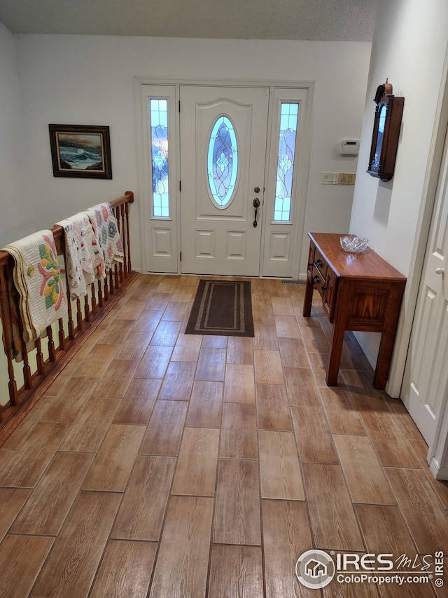 foyer with light wood-type flooring