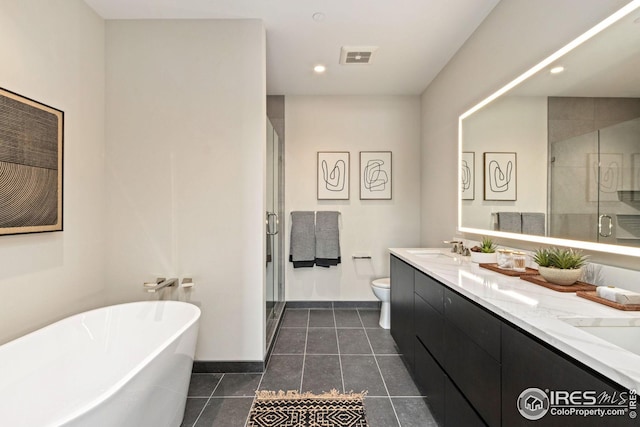 full bathroom featuring a stall shower, visible vents, a sink, and double vanity