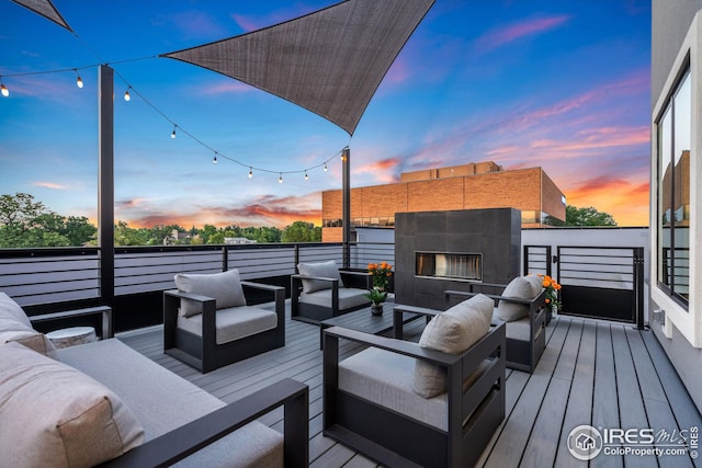 wooden terrace featuring an outdoor hangout area