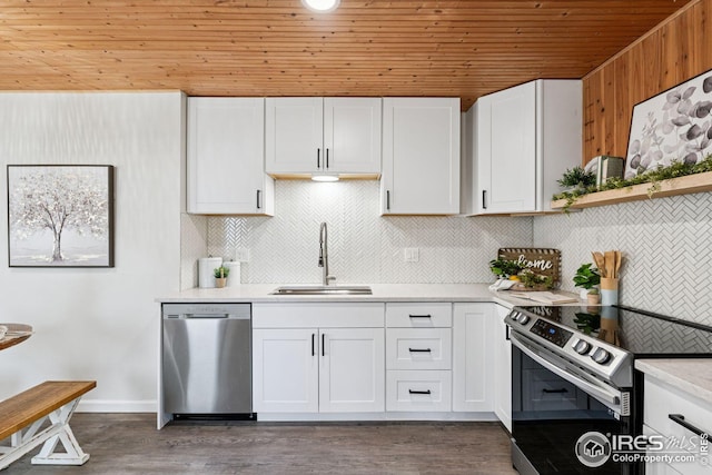 kitchen featuring wood ceiling, appliances with stainless steel finishes, light countertops, white cabinetry, and a sink