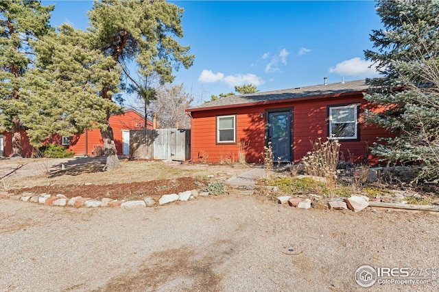 view of front of home featuring fence