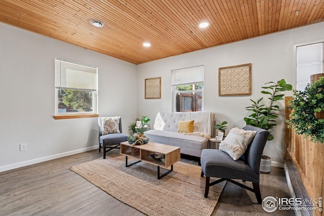 living area featuring recessed lighting, wooden ceiling, wood finished floors, and baseboards