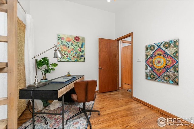 home office featuring baseboards, recessed lighting, and light wood-style floors