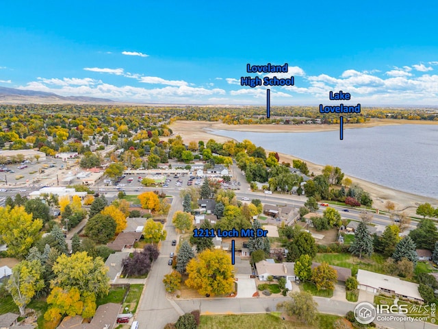 birds eye view of property with a water view