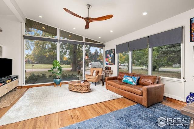 living area with lofted ceiling, a ceiling fan, wood finished floors, and recessed lighting