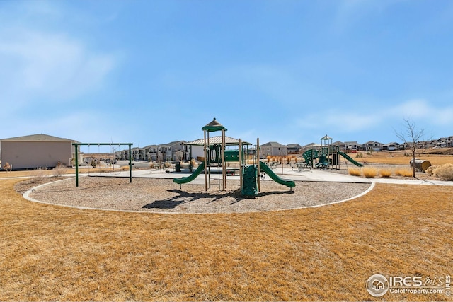 community playground featuring a lawn