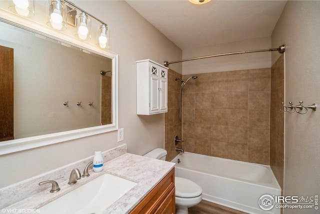 full bathroom with toilet, shower / washtub combination, and vanity