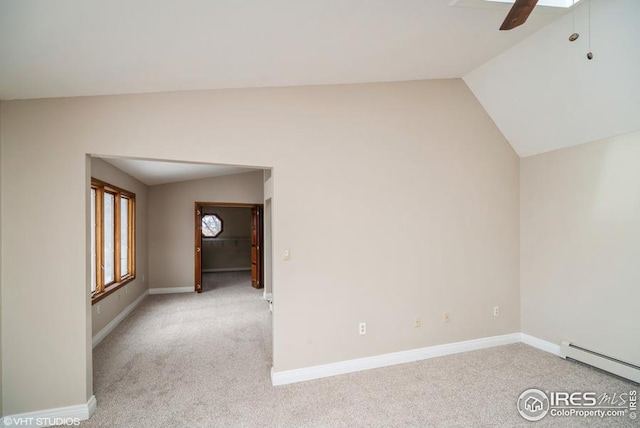 unfurnished room featuring carpet, baseboards, vaulted ceiling, and baseboard heating