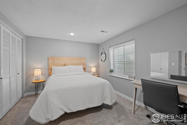 carpeted bedroom with a closet, recessed lighting, visible vents, and baseboards