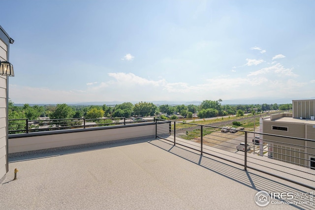 view of patio featuring a balcony