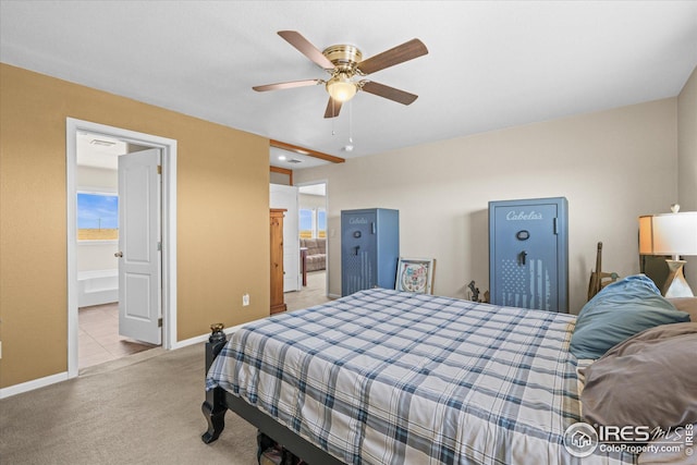 carpeted bedroom with ceiling fan and baseboards