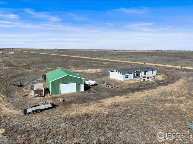 birds eye view of property with a rural view