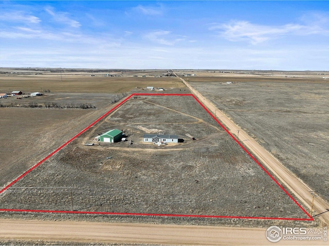 birds eye view of property with a rural view