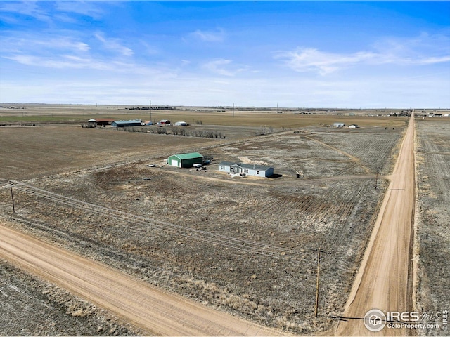 birds eye view of property featuring a rural view