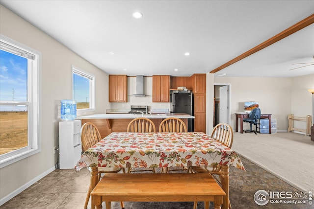 dining space with light carpet, baseboards, a ceiling fan, and recessed lighting